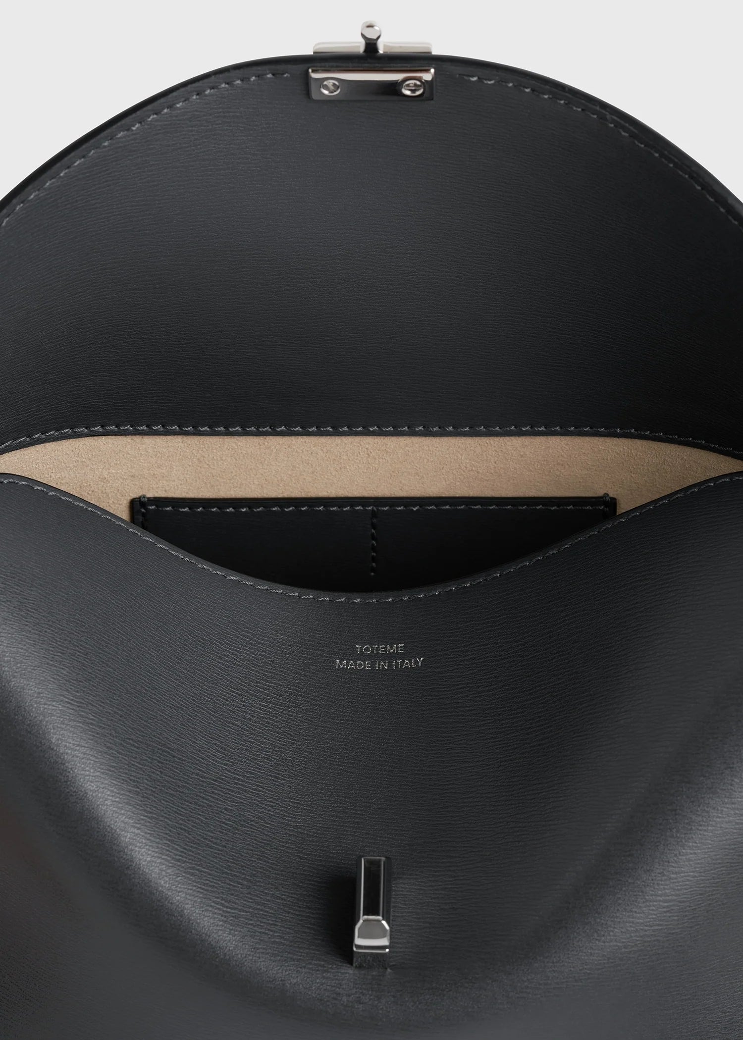 Toteme Clutch T-Lock in leather Shark